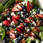 30-Minute Strawberry Spinach Salad with Blueberries, Pecans, Feta cheese, and a Balsamic glaze.